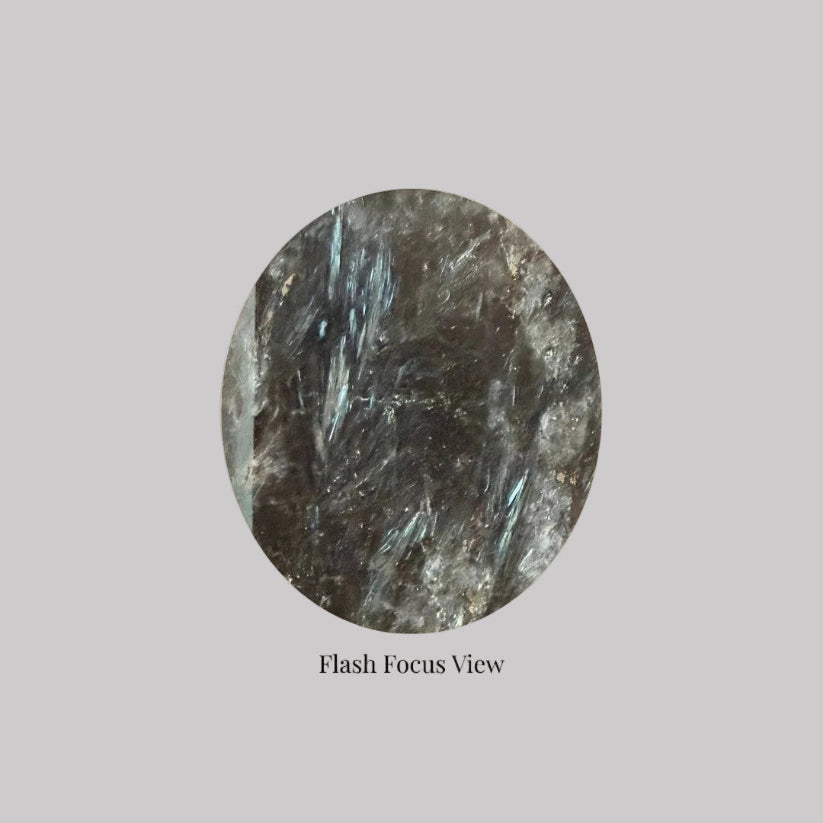 Flash focus view of Arfvedsonite Generator 7inch showcasing natural polished surface with deep blue flashes. Ideal for manifestation and clarity rituals.