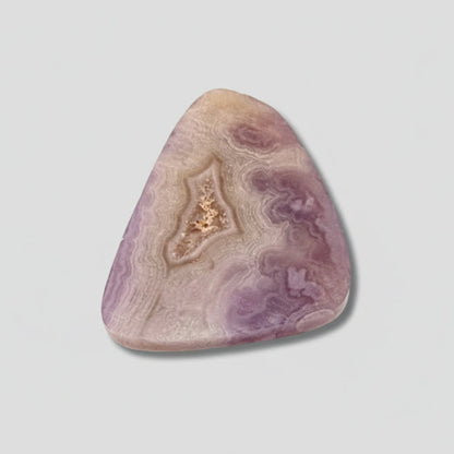 Purple Aztec Lace Agate Cabochon 32.5 Cts with intricate lace patterns and polished triangular shape, ideal for jewelry or crystal healing use.
