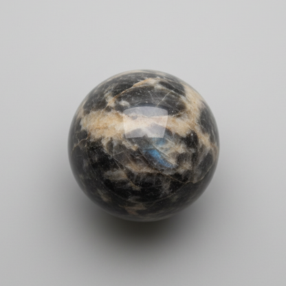 Soulful Black Moonstone Sphere with shimmering surface, ideal for enhancing intuition and meditation. A unique collectible gemstone sphere.