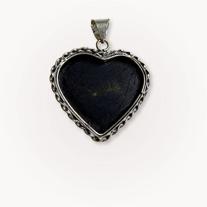 Back view of Black Tourmaline Heart Pendant with silver frame, emphasizing handcrafted details and crystal's protective properties.