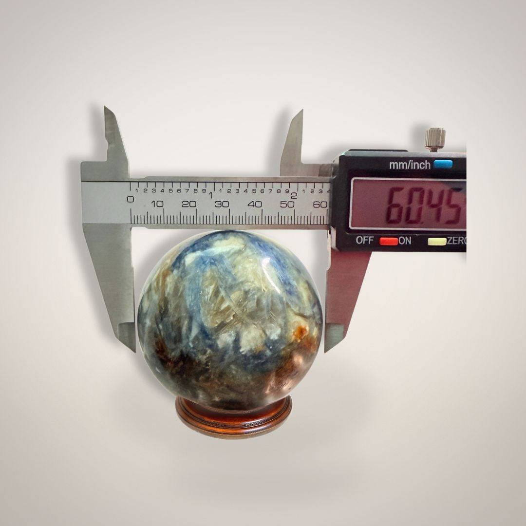 Blue Kyanite & Quartz Sphere 61mm for alignment and insight, displayed with digital caliper showing 60.45mm diameter. Ideal for crystal healing.