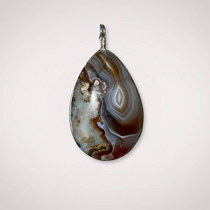 Botswana Agate pendant back view showing finished back with intricate patterns