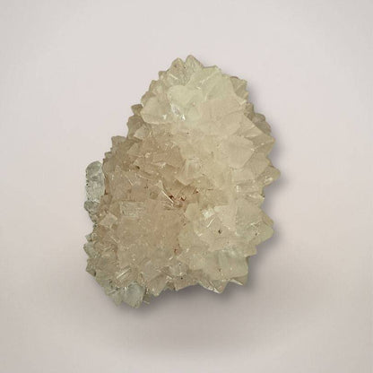 Large fluorescent pinecone calcite cluster with phosphorescent glow, India