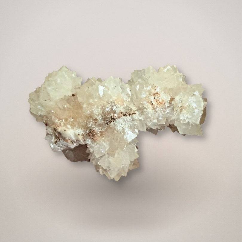 UV fluorescent pinecone calcite cluster with phosphorescent glow from India Bottom view