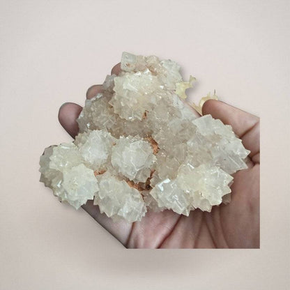 UV fluorescent pinecone calcite cluster specimen from India - in hand scale view