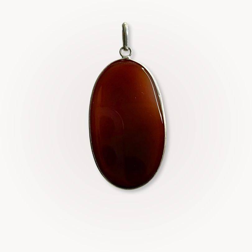 Back view of Carnelian Statement Pendant highlighting the smooth, rich-toned gemstone set in silver, perfect for crystal healing jewelry collections.