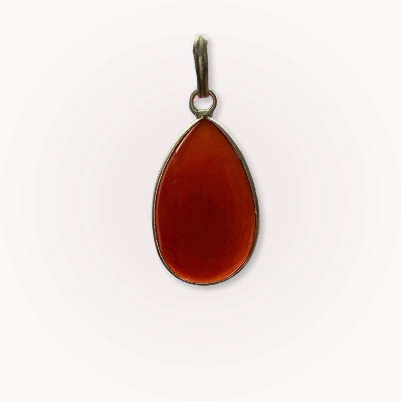 Back view of Carnelian Classic Pendant showing translucent red-orange crystal in smooth silver setting for vitality and confidence.