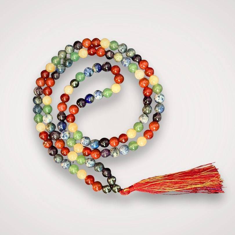 Chakra Mala Necklace for Energetic Alignment featuring 108 colorful natural stone beads with red and yellow tassel, ideal for meditation and balance.