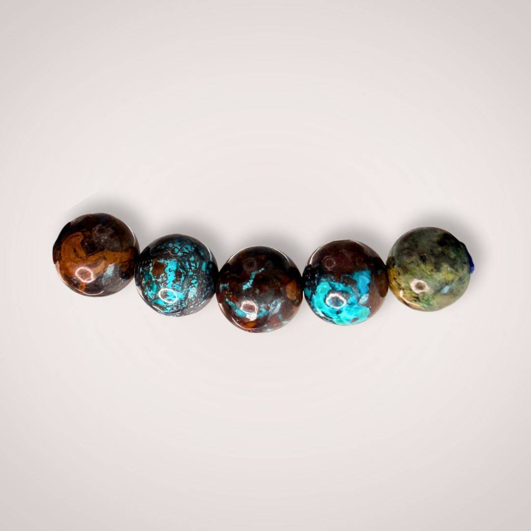 Close-up of five 6mm Peruvian Chrysocolla beads, revealing intricate natural patterns and vibrant blue-green coloration for emotional balance.