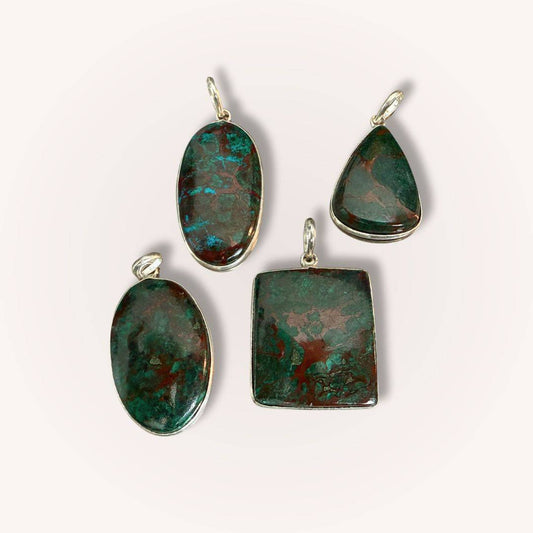 Assorted Chrysocolla Pendants for Calm & Heart Healing by Mystic Parcel in oval, teardrop, and square shapes with green and copper tones.