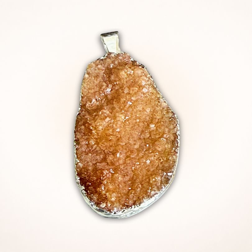 Oval-shaped Brazil Citrine Drusy Cluster Pendant in .925 Silver Bezel featuring light orange druzy crystals and smooth silver bail.
