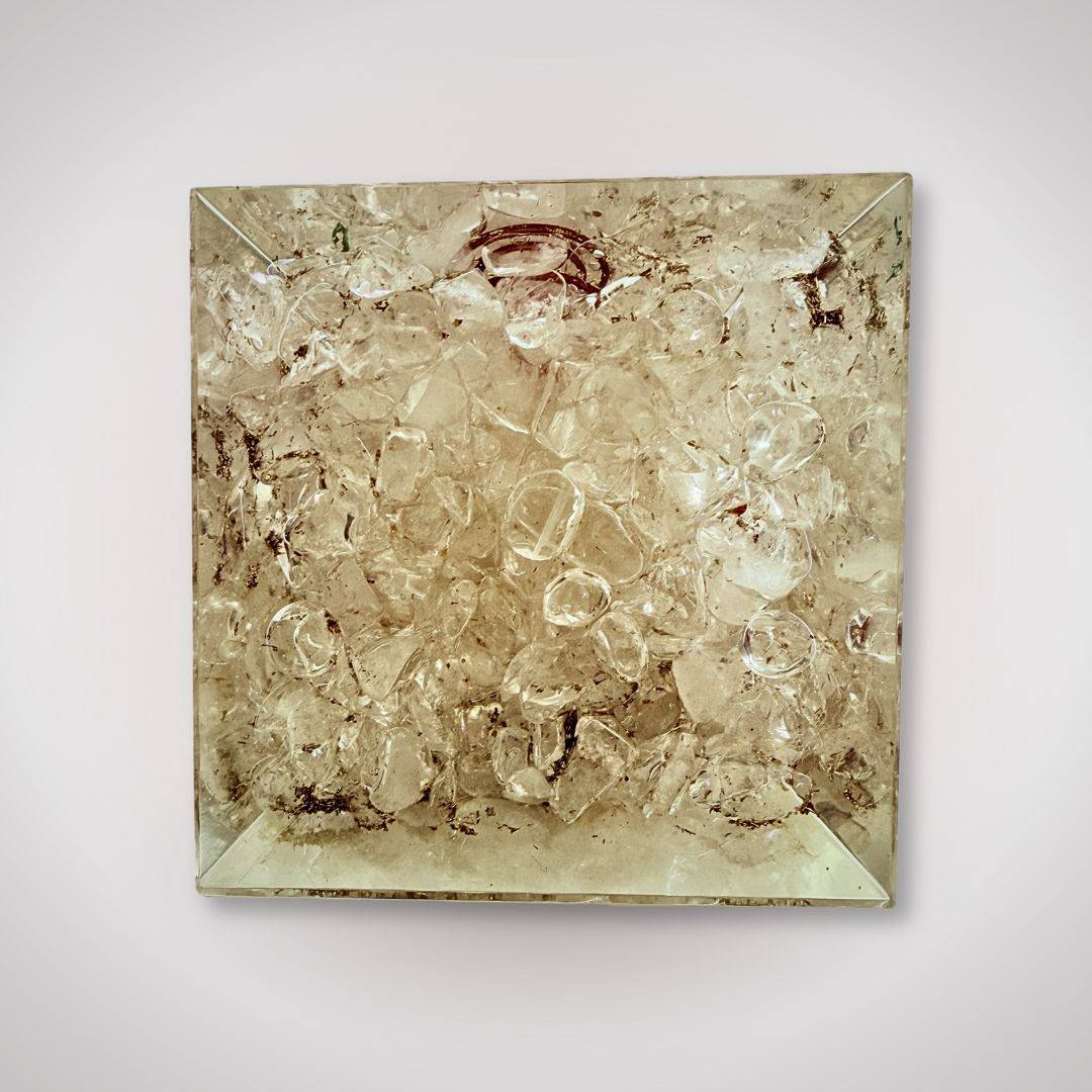 Bottom view of Clear Quartz Orgonite Pyramid filled with raw quartz crystals, enhancing energy flow and decorative appeal.