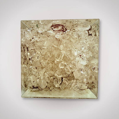 Bottom view of Clear Quartz Orgonite Pyramid filled with raw quartz crystals, enhancing energy flow and decorative appeal.