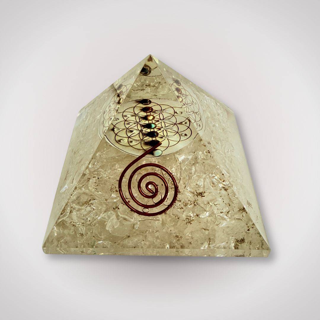 Clear Quartz Flower of Life Orgonite Pyramid featuring chakra stones and copper spiral for energy alignment and home decor.