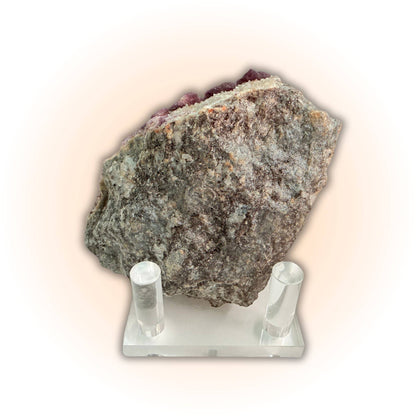 Backside of Deep Violet Botryoidal Fluorite Crystals Specimen on display stand, revealing raw stone matrix and natural texture.