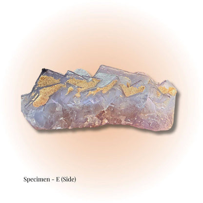 Brazilian Purple Fluorite crystal specimen E side view showcasing natural purple hues and golden mineral inclusions for clarity and focus.