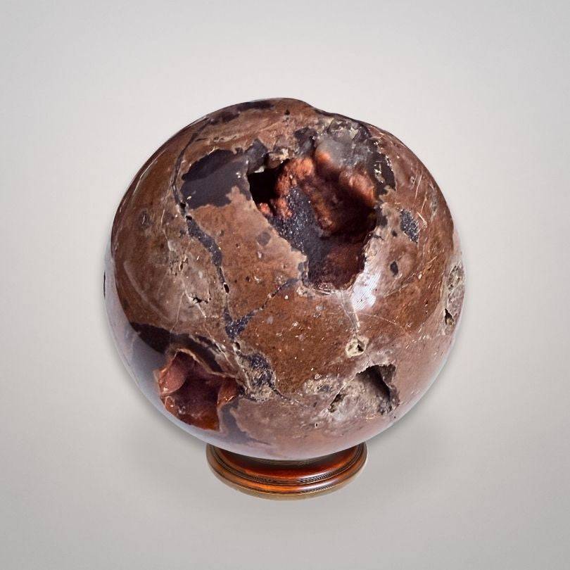 Red Fox Agate Sphere (346g) — Argentine agate with hematite inclusions, featuring deep shamanic portals and polished surface for collectors.
