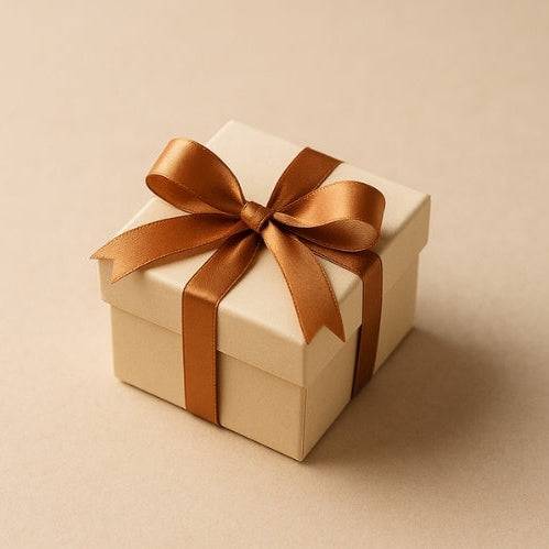 Mystic Parcel Surprise Gift for Purchase of $100+ Beige gift box with a brown ribbon on a beige background