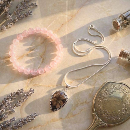 Thread of Companionship Aligned Pairing | Friendship Jewelry Set featuring a pink Manganese Calcite bracelet and Chiastolite pendant on a silver chain. Ideal for emotional support and friendship bonding.