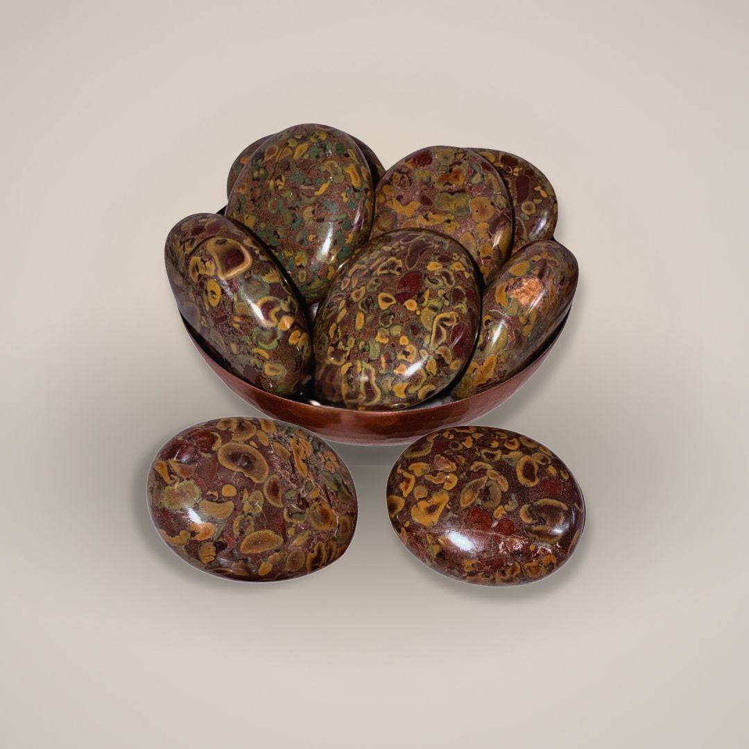 Multiple Fruit Ajooba Jasper Palm Stones in bowl with close-up view