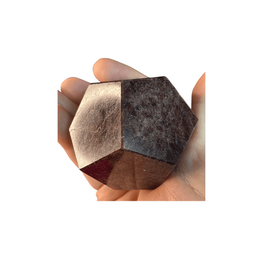 Hand holding a polished Garnet Dodecahedron Crystal for Grounding & Vitality, ideal for gemstone collectors and spiritual healing practices.