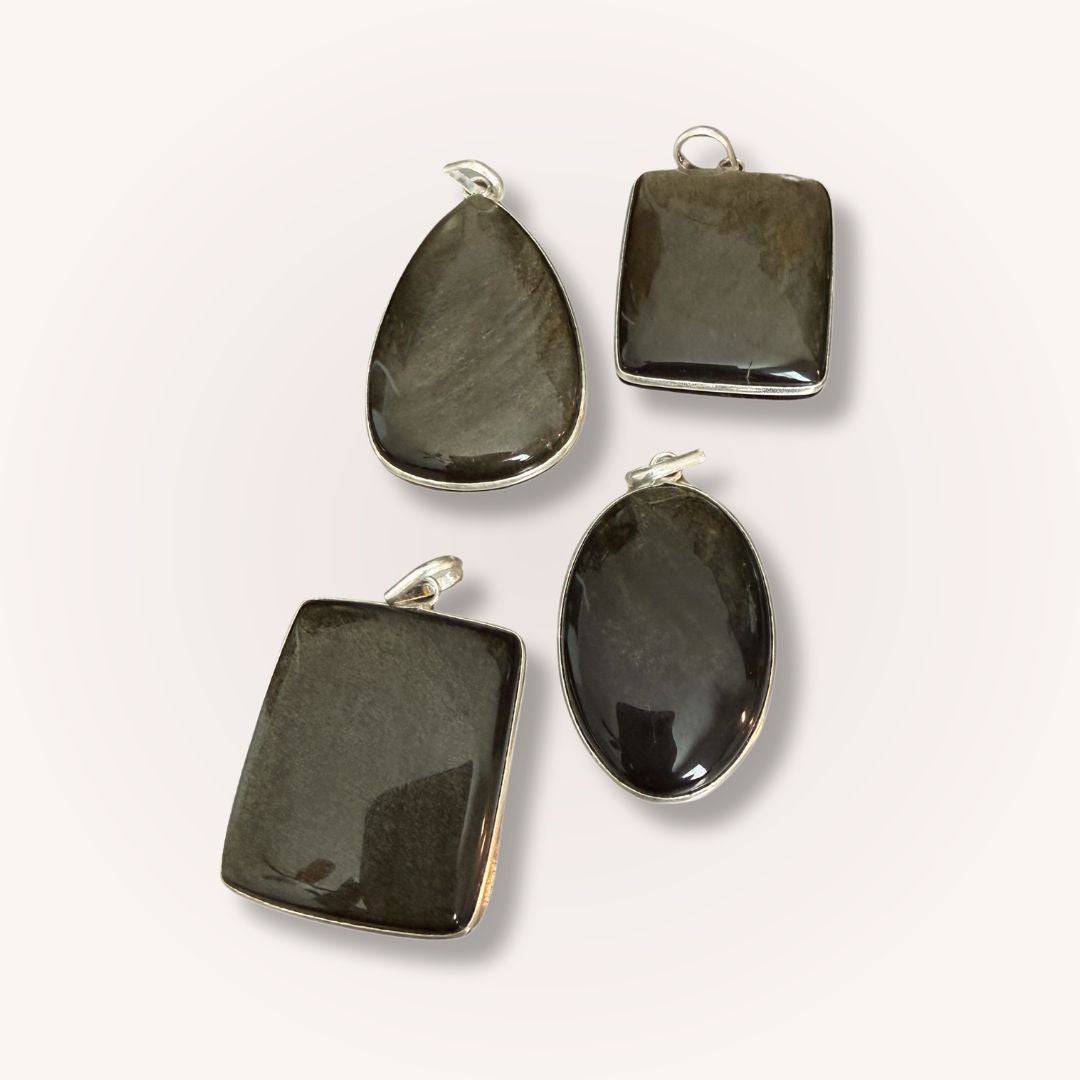 Assorted Gold Sheen Obsidian Pendants in oval, teardrop, and rectangular shapes. Perfect for grounding, clarity, and protection jewelry collections.