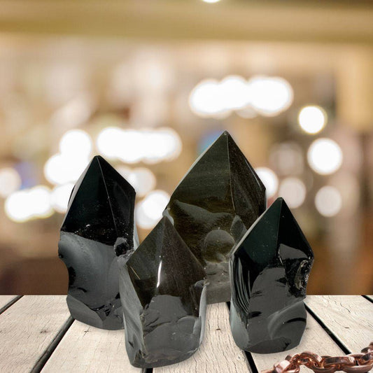 Set of three Gold Sheen Obsidian Generators with top polish and natural sides displayed on wooden surface, perfect for shadow work and energy healing.