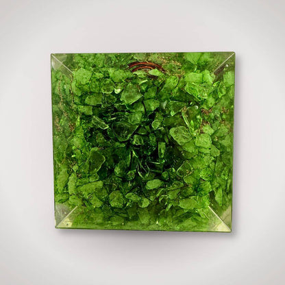 Top view of Green Quartz Chakra Orgonite Pyramid showing vibrant green crystal chips, used for home energy decor and healing.