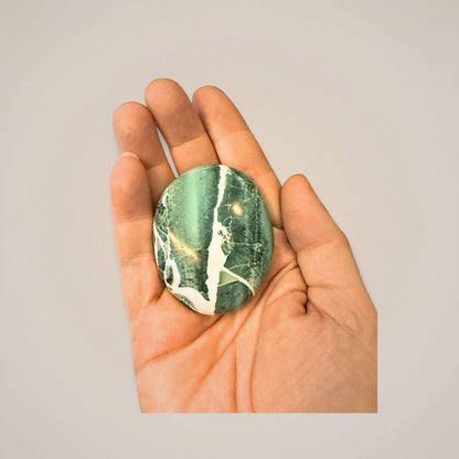 Green Zebra Jasper palm stone in hand for energy work