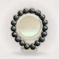 Hematite 12mm Beaded Bracelet - Grounding & Stable Protective accessory featuring polished black natural stone beads in a circular display.