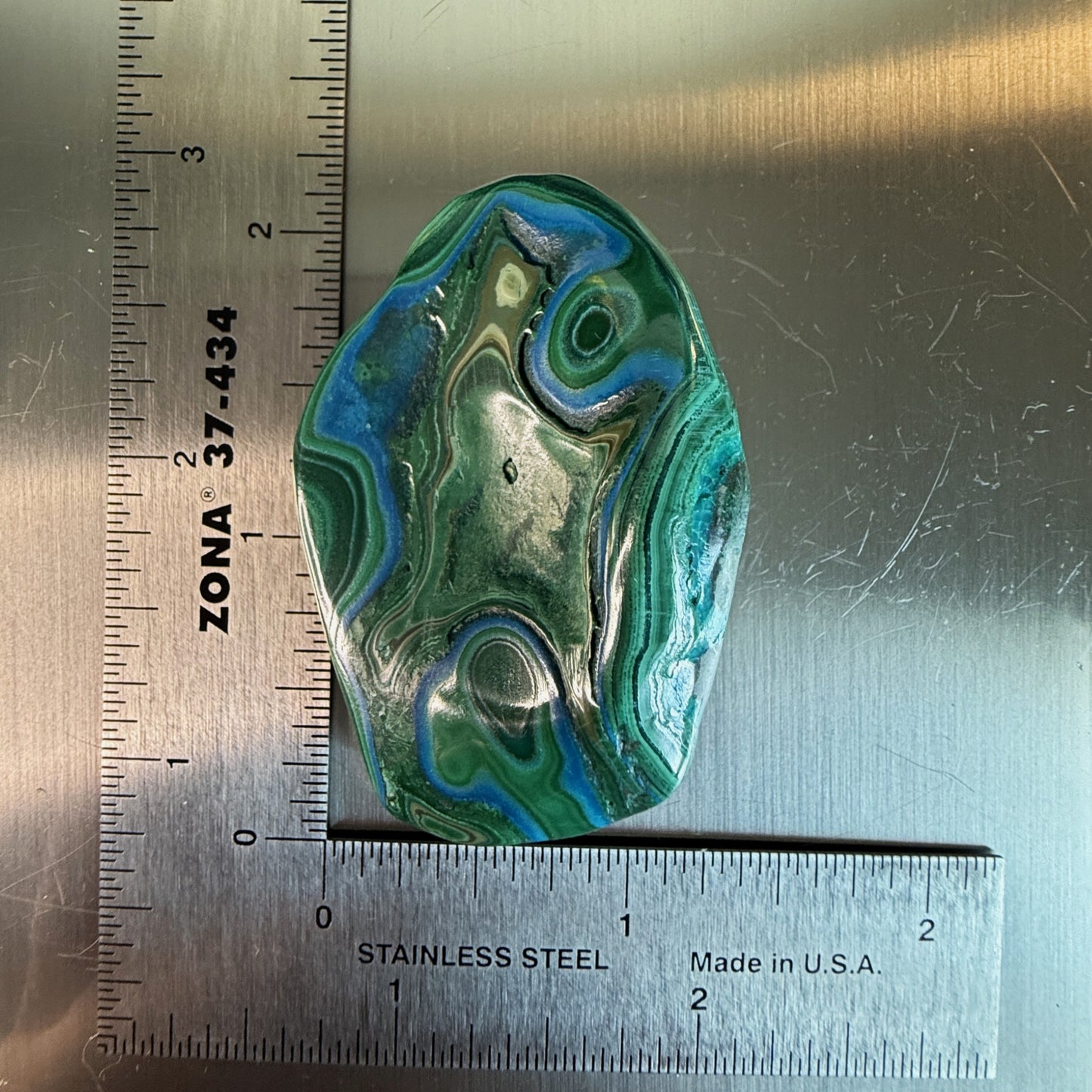 Colorful MalaColla Freeform featuring layered malachite and chrysocolla, oval shape shown with ruler for accurate sizing.