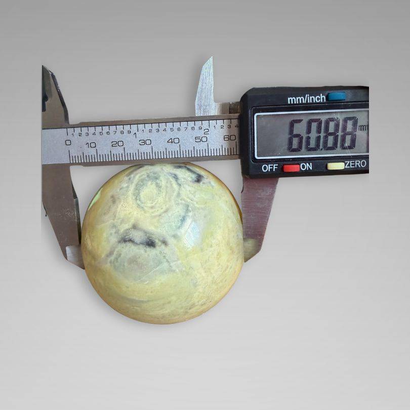 Infinite Stone Sphere from Peru measured at 60.88 mm diameter, ideal for Heart Chakra healing and gemstone enthusiasts.