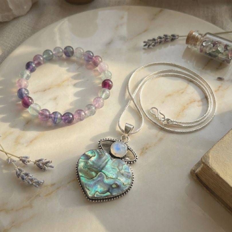 Inner Compass Aligned Pairing - Intuition and Clarity Set featuring a fluorite beaded bracelet and abalone heart pendant with moonstone on a silver chain.
