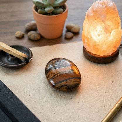 Tiger Iron Palm Stone on table with a Salt Lamp and plant