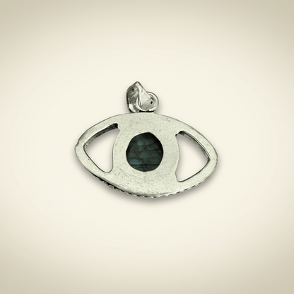 Labradorite Evil Eye Pendant in silver setting for transformation and protection. Features a central labradorite stone with open eye design.