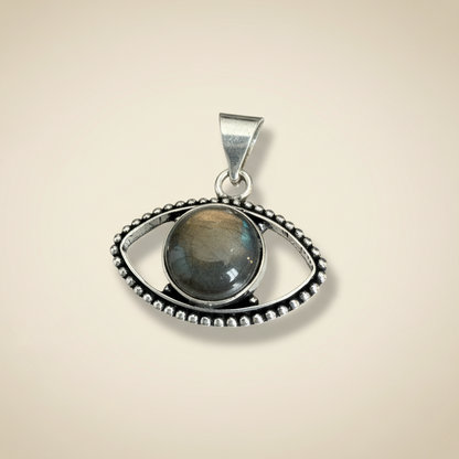 Labradorite Evil Eye Pendant featuring a polished labradorite stone set in a silver eye-shaped frame for transformation and protection jewelry.