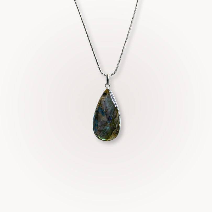 Labradorite Statement Pendant with blue flash on silver chain, designed for intuition and protection in jewelry collections.