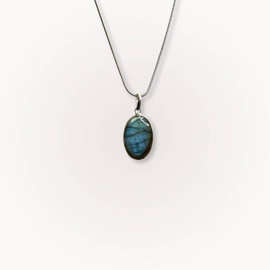 Labradorite Classic Pendant with oval gemstone on silver chain, offering intuition, protection, and clarity for daily spiritual wear.