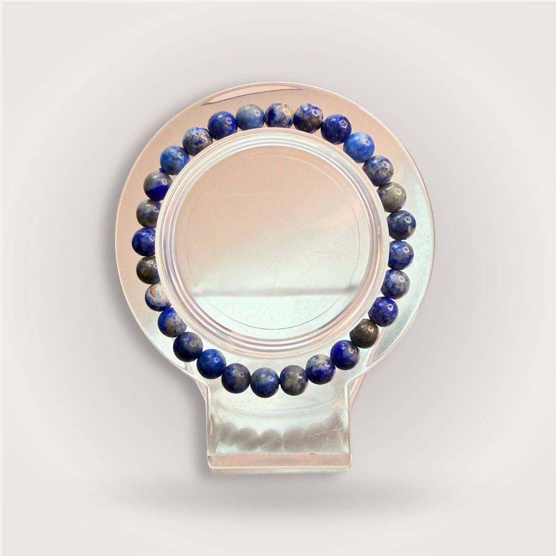 Lapis Lazuli Bracelet - Intuition & Wisdom | 6mm Beads displayed on a clear stand, showcasing deep blue ethically sourced stones.