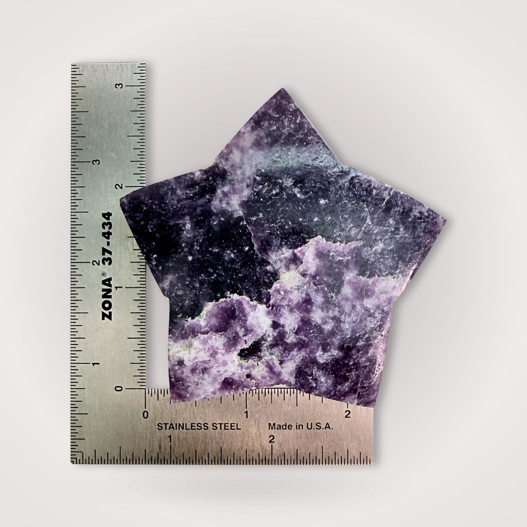 Lepidolite Star Crystal Carving measured with a ruler, showing size and detail for use in calming home decor and emotional wellness spaces.