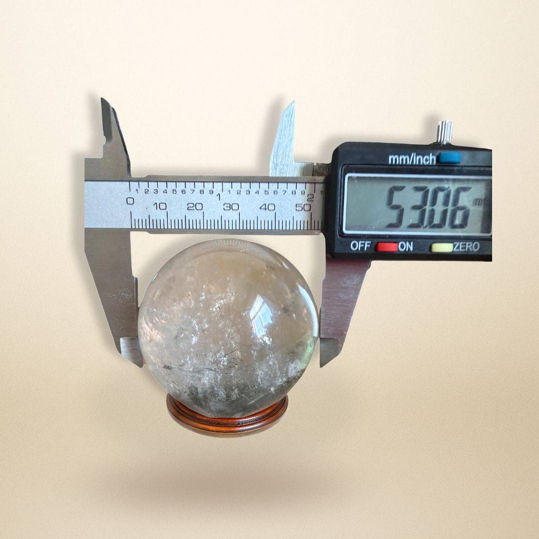 Lodolite Garden Quartz Sphere measured at 53.06mm diameter, ideal gemstone collectible for manifestation and spiritual use.