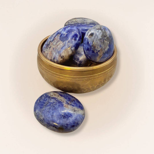 Group of medium Sodalite palm stones in a brass bowl, polished for calming clarity and peaceful rest, perfect for mineral collectors.