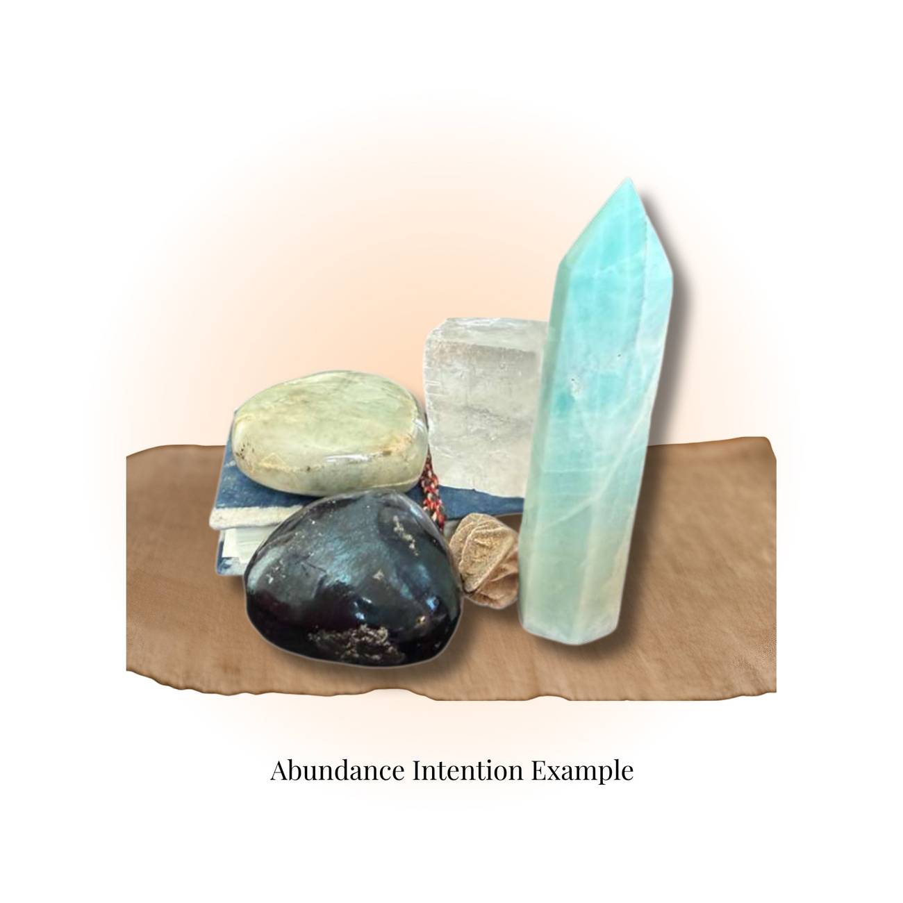 Magical Crystal Mystery Box – Crystals, Oils & Herbs | Mystic Parcel featuring polished gemstones, a crystal tower, and herbs for abundance intention.