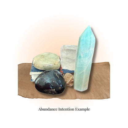 Magical Crystal Mystery Box – Crystals, Oils & Herbs | Mystic Parcel featuring polished gemstones, a crystal tower, and herbs for abundance intention.