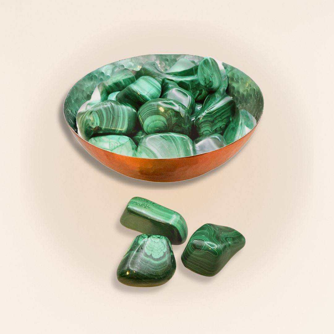 Copper bowl filled with Malachite Tumbled Stones, perfect for decorative bowls in home and garden decor with healing energy appeal.