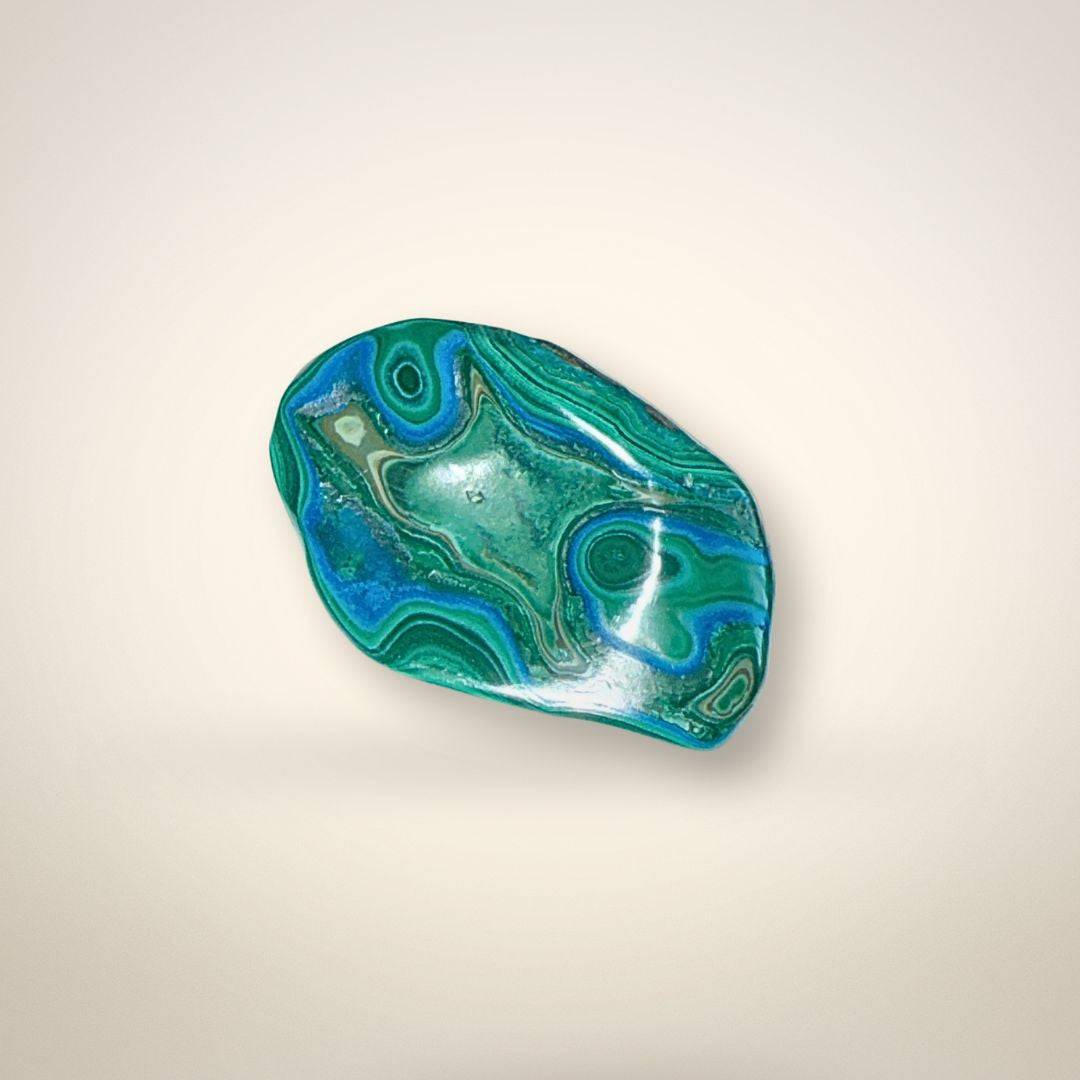 Oval Malacholla Freeform specimen with striking blue and green chrysocolla and malachite bands, symbolizing courage and communication.