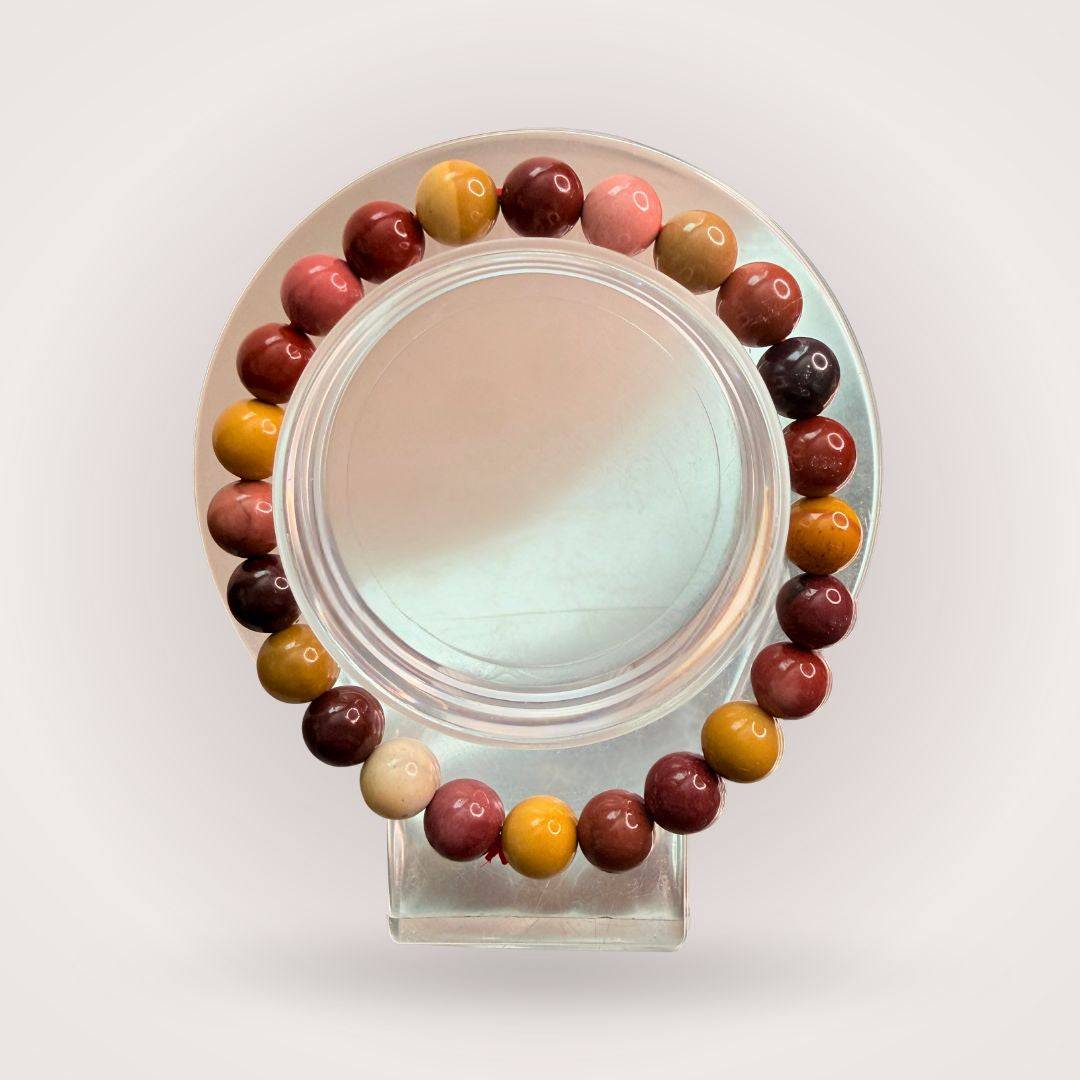 Mookaite Jasper 8mm Beaded Bracelet featuring multicolored polished stones in earthy tones, ideal for grounding and strength energy.