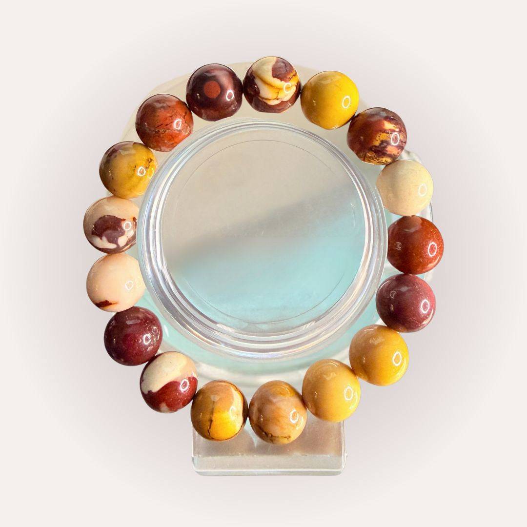 Mookaite Bracelet 12mm featuring polished multicolor beads in earthy tones, ideal for grounding and confidence crystal jewelry.
