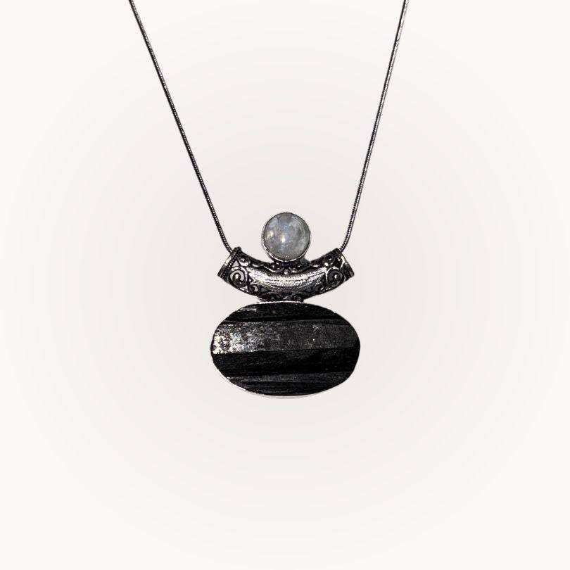 Moonstone & Black Tourmaline Pendant with raw-front Tourmaline and polished Moonstone in silver bezel for protection and intuition.