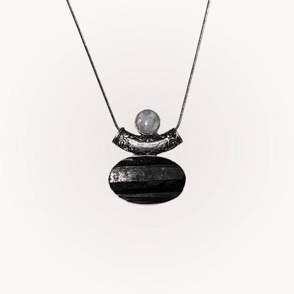 Moonstone & Black Tourmaline Pendant with raw-front Tourmaline and polished Moonstone in silver bezel for protection and intuition.
